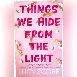 Things We Hide From The Light by Lucy Score (paperback)